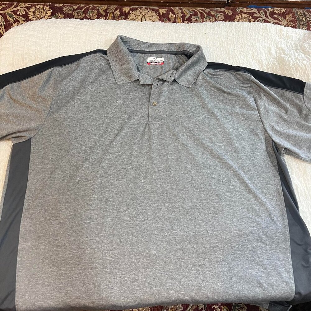 Gray golf shirt with Black on shoulder and side